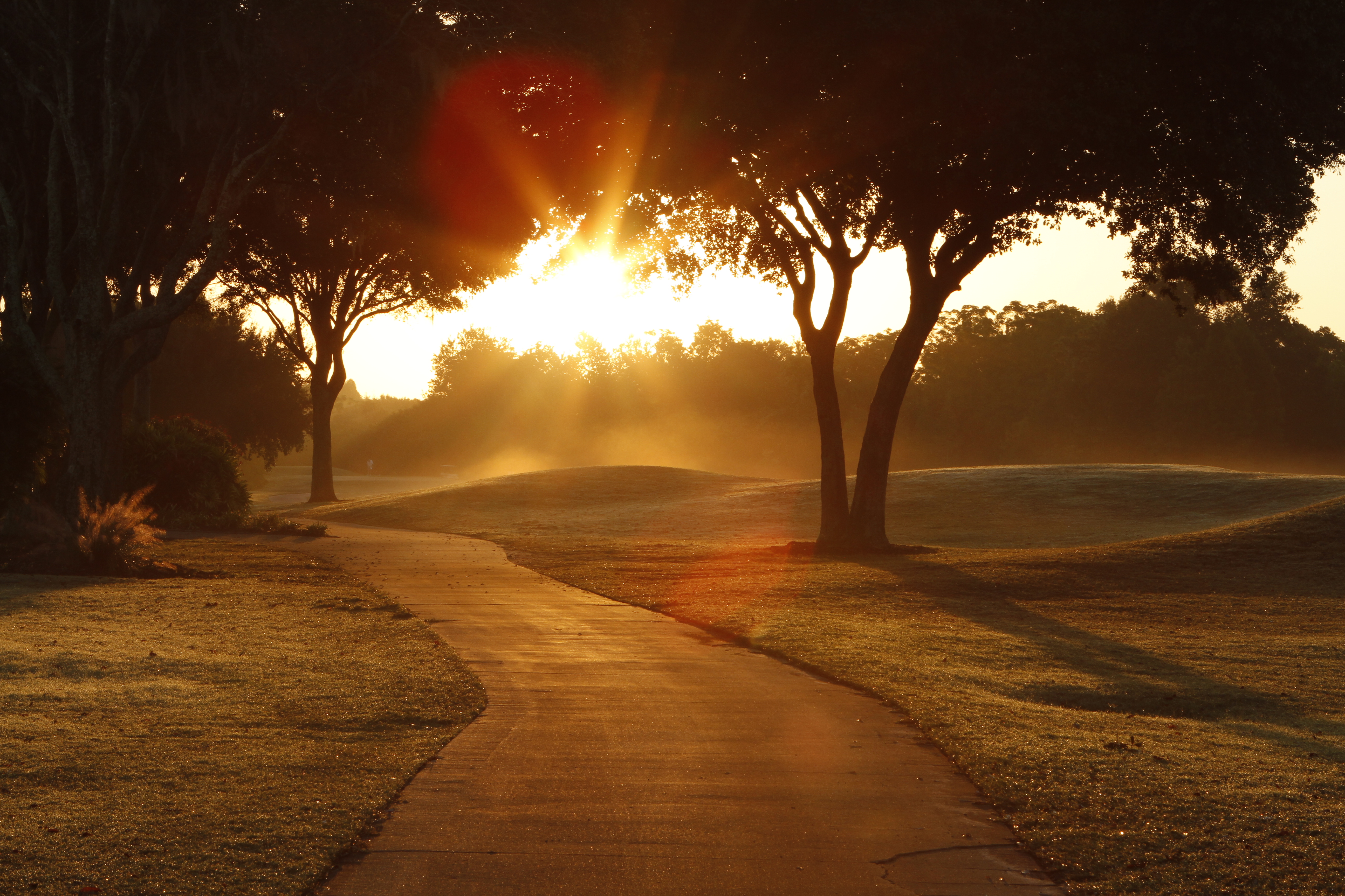 Walkway at sunset golfer in Hua Hin